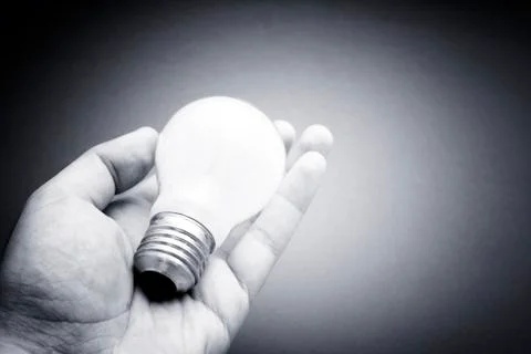 Background with lit lightbulb Stock Photos