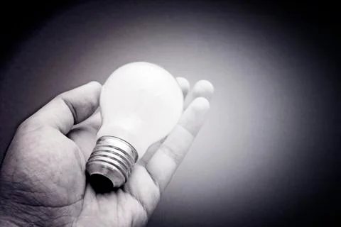 Background with lit lightbulb Stock-Fotos