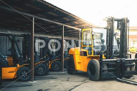 Background of a lot of forklifts, reliable heavy loader, truck Stock Photos