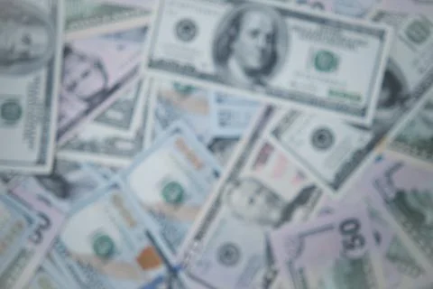 The background is made of American dollars. Stock Photos