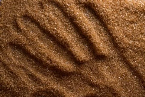 The background is made of brown sugar. background from food. background with Stock Photos