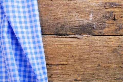 The background made from checkered napkin on old wooden table Stock Photos