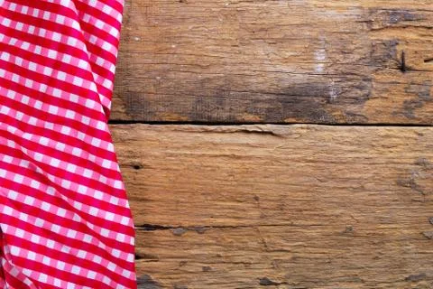 The background made from checkered napkin on old wooden table Stock Photos