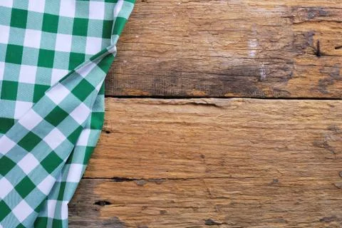 The background made from checkered napkin on old wooden table Stock Photos