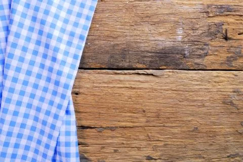 The background made from checkered napkin on old wooden table Stock Photos