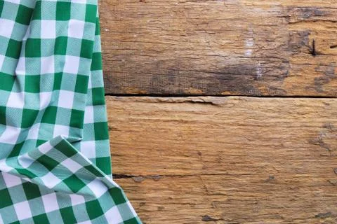 The background made from checkered napkin on old wooden table Stock Photos