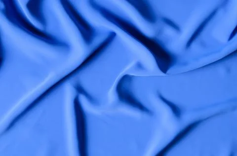 The background is made of a delicate blue chiffon fabric with folds in the fo Foto stock