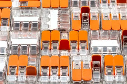 Background made of multiple couplers for strands and solid conductors for ele Stock Photos