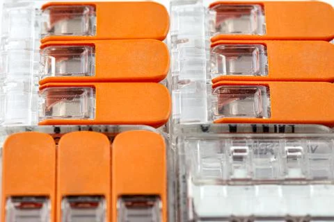 Background made of multiple couplers for strands and solid conductors for ele Stock Photos