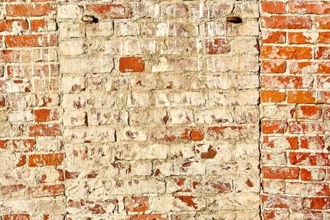 The background is made of old old red brick and peeling plaster Stock Photos
