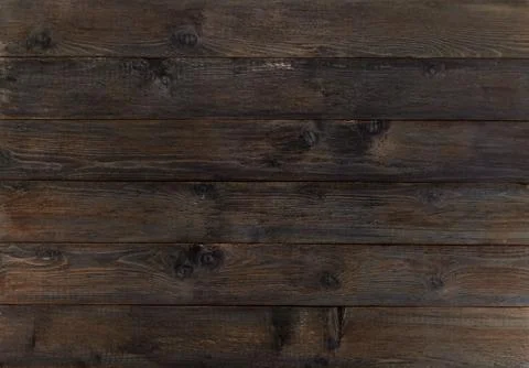 The background is made of old worn boards. Stock Photos