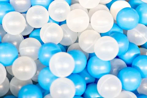 The background is made of plastic whites. Blue balls in the playroom Stock Photos