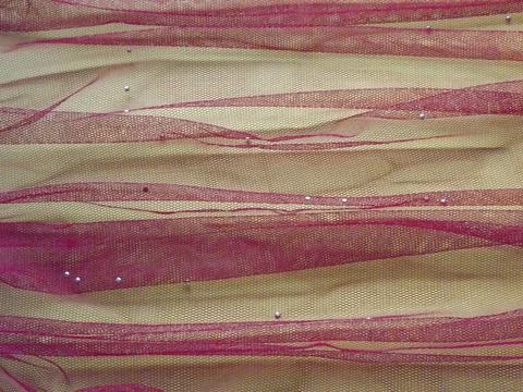 Background made of red translucent fabric on a white base Foto stock