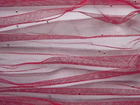 Background made of red translucent fabric on a white base Foto stock