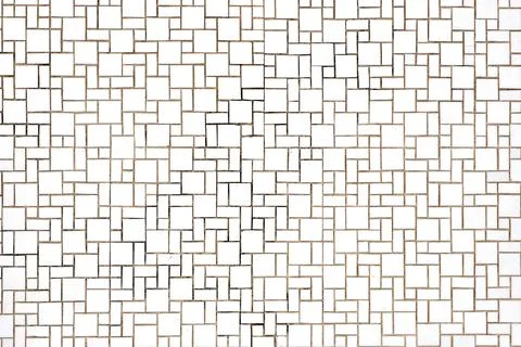 Background made of a wall of rectangular and square white mosaic tiles Stock Photos