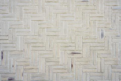 Background made from a wall of small beige bricks Foto stock