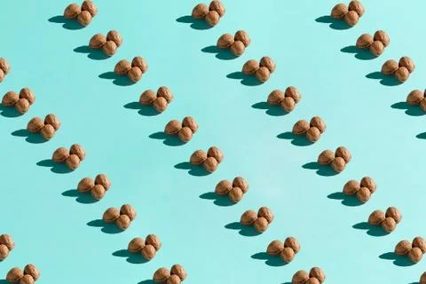 Background made from walnuts on the blue background Stock Photos