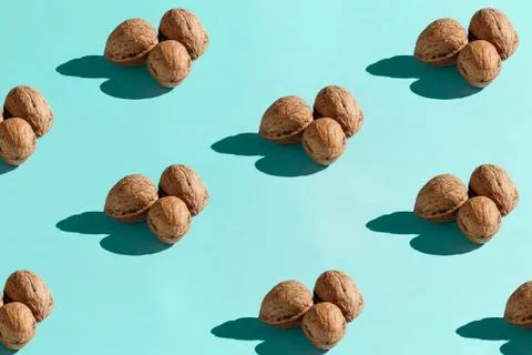 Background made from walnuts on the blue background Stock Photos