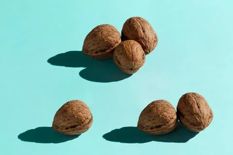 Background made from walnuts on the blue background Stock Photos