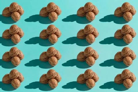 Background made from walnuts on the blue background Stock Photos