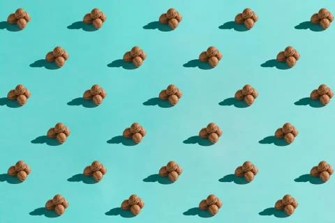 Background made from walnuts on the blue background Stock Photos