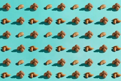Background made from walnuts on the blue background Stock Photos
