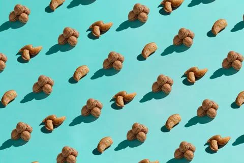 Background made from walnuts on the blue background Stock Photos