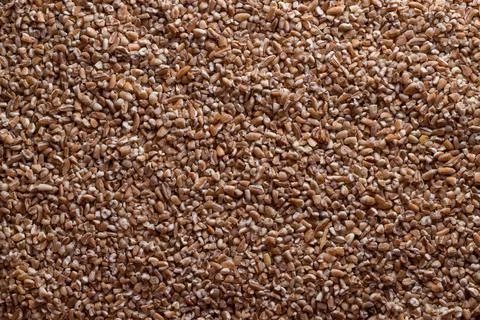 The background is made of wheat grits. background from the food. Stock Photos