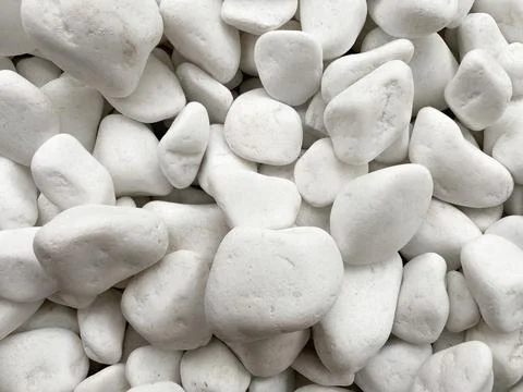The background is made of white smooth pebbles of white color. Textured pebbles Stock Photos