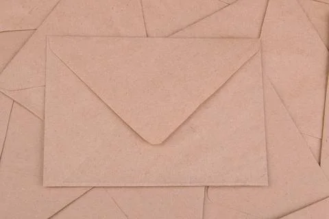 Background from mail envelopes from craft paper. view from above. mail or del Stock Photos