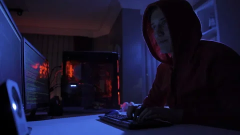 Background of male hacker using computer to commit crime. Stock Footage 220159916