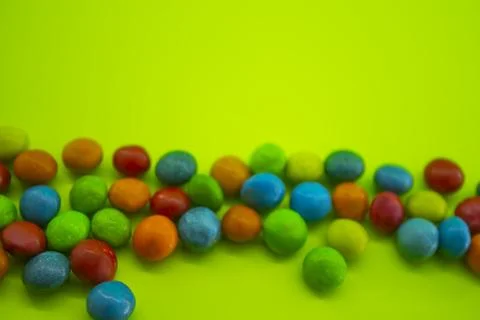 Background of many multicolored candies or chocolates Stock Photos