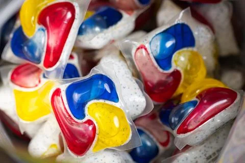 Background of Many Multicolored Dishwasher Detergent Pods Stock Photos