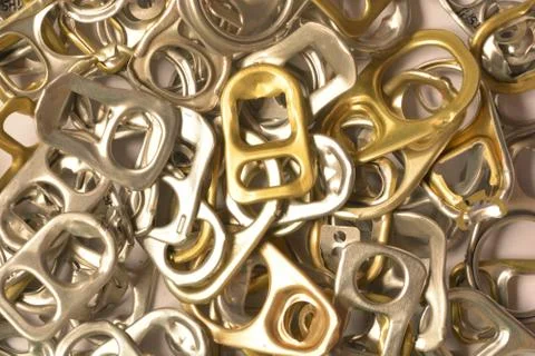 Background of many ring pull can opener, silver and gold. Foto stock