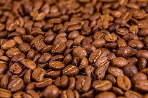 Background of many roasted coffee beans. Selective focus Stock Photos