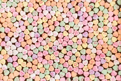 A background of many tiny conversation heart candies Stock Photos