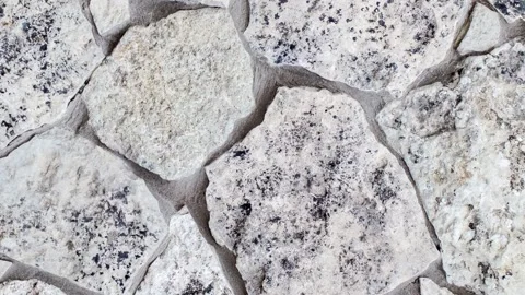 Background, masonry wall of stones of different irregular shapes Stock Footage 243992289