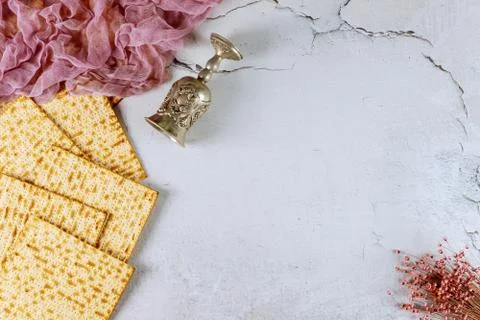 Background of matzah bread with kiddush and flowers. Jewish Passover holiday  Stock Photos