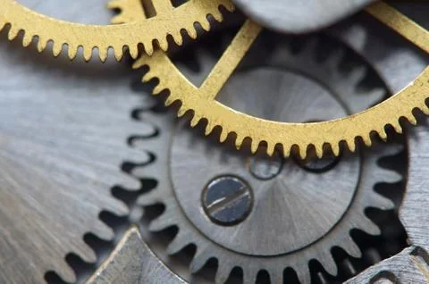 Background with metal cogwheels a clockwork. macro Stock Photos