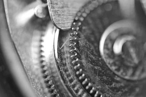 Background with metal cogwheels a clockwork. Macro Stock Photos