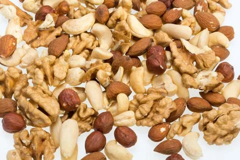 Background of mixed nuts -  hazelnuts, walnuts, cashews,  pine nuts Foto stock
