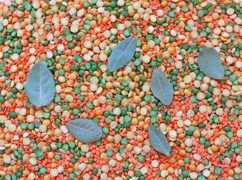Background of a mixture of peas, bay leaf and lentils Stock Photos
