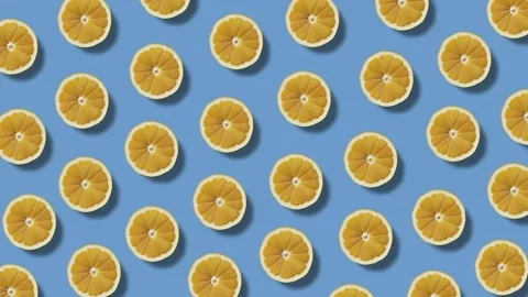 Background of moving lemon halves on a blue background Vídeos de archivo 246964989