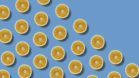 Background of moving lemon halves on a blue background Stock-Footage 246966356
