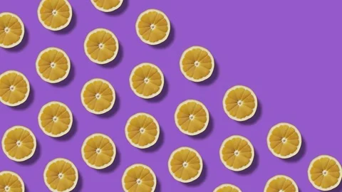 Background of moving lemon halves on a violet background Vídeos de archivo 246965790