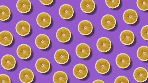 Background of moving lemon halves on a violet background 스톡 동영상 246965887