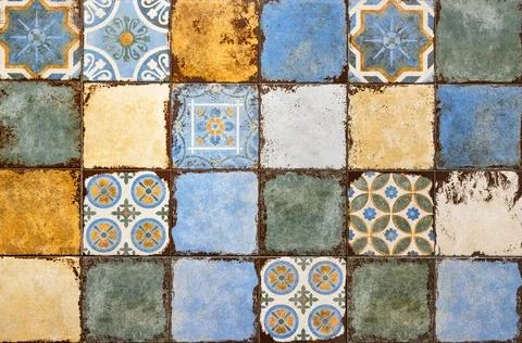 Background of multi-colored aged ceramic tiles. Stock Photos
