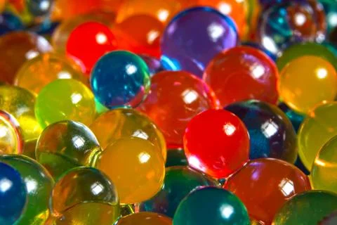 Background of multi-colored, blurry, wet hydrogel balls Stock-Fotos