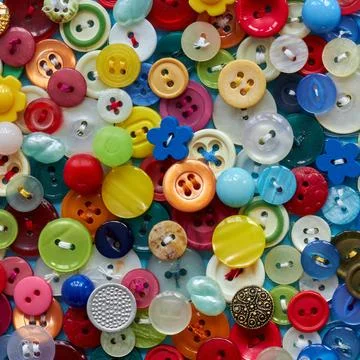 Background from multi-colored clothes buttons. Colorful background Stock Photos