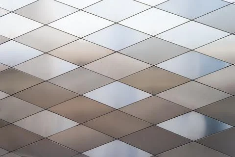 Background of multi-colored diamond-shaped metal panels, close-up Stock Photos